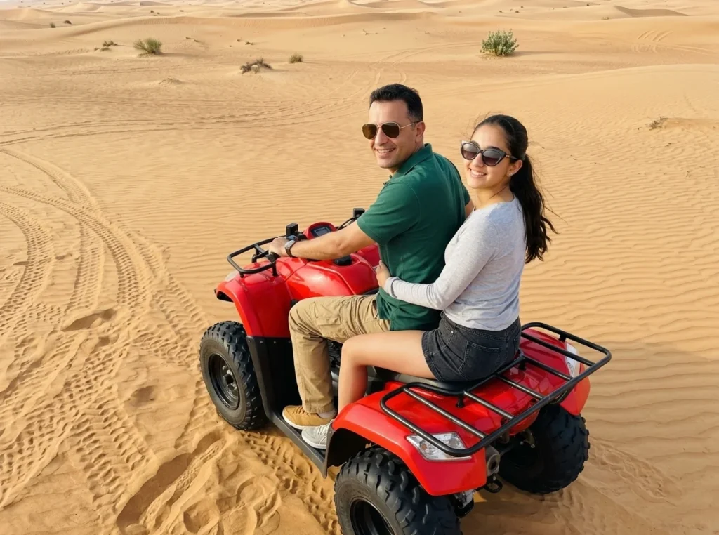 Quad bike riders exploring the red dunes of Lahbab Desert near Dubai, surrounded by expansive sandy landscapes during an outdoor adventure tour.