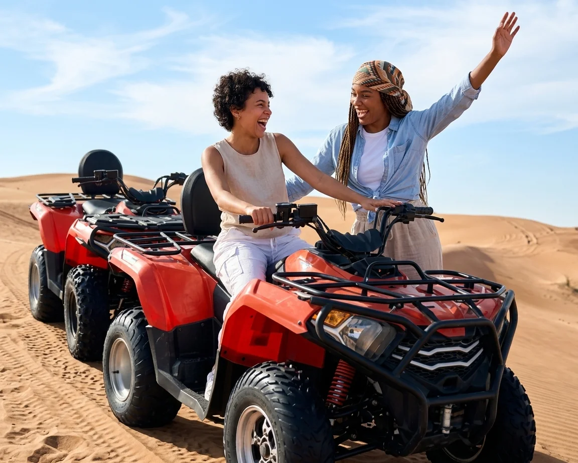 Quad bike rider crossing Dubai's red dunes during an off-road desert adventure surrounded by dramatic sandy terrain.